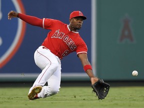 Los Angeles Angels left fielder Justin Upton makes a catch on a ball hit by Chicago White Sox's Jose Abreu during the first inning of a baseball game Tuesday, July 24, 2018, in Anaheim, Calif.