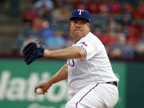 Texas Rangers starting pitcher Bartolo Colon throws to an Oakland Athletics batter during the first inning of a baseball game Thursday, July 26, 2018, in Arlington, Texas.