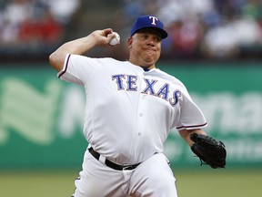Texas Rangers starting pitcher Bartolo Colon delivers to a Cleveland Indians batter during the first inning of a baseball game, Saturday, July 21, 2018, in Arlington, Texas.