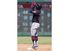 Cleveland Indians'Francisco Lindor gestures after hitting a double during the eighth inning of a baseball game against the Texas Rangers, Sunday, July 22, 2018, in Arlington, Texas.