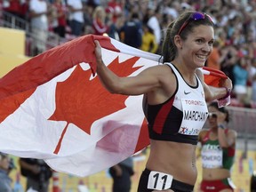 Lanni Marchant celebrates her third-place finish in the women's 10,000-metre final at the 2015 Pan Am Games in Toronto.