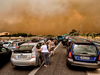 Cars are blocked at the closed National Road during a wildfire in Kineta, near Athens, on July 23, 2018.
