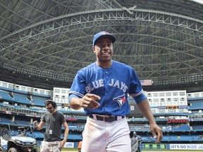 Toronto Blue Jays outfielder Curtis Granderson walks off the field after a win against the Baltimore Orioles on June 10.