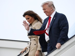 President Donald Trump and Melania Trump walks from Air Force One at Melsbroek Air Base, Tuesday, July 10, 2018, in Brussels, Belgium.