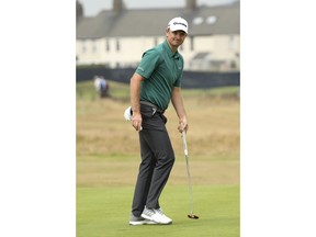 Justin Rose of England prepares to putt on the 16th green during the third round of the British Open Golf Championship in Carnoustie, Scotland, Saturday July 21, 2018.