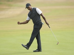 Tiger Woods of the US celebrates a birdie on the 9th hole during the third round of the British Open Golf Championship in Carnoustie, Scotland, Saturday July 21, 2018.