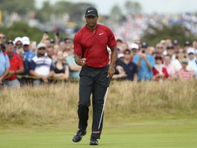 Tiger Woods of the US after a birdie putt on the 4th hole during the final round of the British Open Golf Championship in Carnoustie, Scotland, Sunday July 22, 2018.