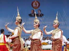 FILE - In this Saturday, July 7, 2018, file photo, dancers perform during a campaign rally of Cambodian Prime Minister Hun Sen's Cambodian People's Party in Phnom Penh, Cambodia. Cambodians voting in the general election on Sunday, July 29,  will have a nominal choice of 20 parties but in reality, only two serious options: extend Prime Minister Hun Sen's 33 years in power or not vote at all.