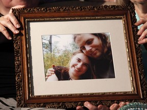 Mothers Linda Boyle, left and Lyn Coleman hold a photo of their married children, Joshua Boyle and Caitlan Coleman, who had been kidnapped by the Taliban in late 2012, on Wednesday, June 4, 2014, in Stewartstown, Pa.