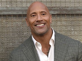 FILE - In this April 4, 2018 file photo, Dwayne Johnson arrives at the world premiere of "Rampage" at the Microsoft Theater in Los Angeles. Johnson, who plays an amputee in the action movie "Skyscraper" said Thursday, July 12, he is joining the Boston-based Ruderman Family Foundation, calling for more inclusion and opportunities for people with disabilities in the entertainment industry.