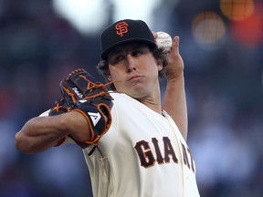 San Francisco Giants pitcher Derek Holland works against the Chicago Cubs during the first inning of a baseball game Tuesday, July 10, 2018, in San Francisco.