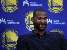 Golden State Warriors' DeMarcus Cousins smiles during a media conference Thursday, July 19, 2018, in Oakland, Calif. Cousins signed a one-year, $5.3M deal with the defending champion Warriors.