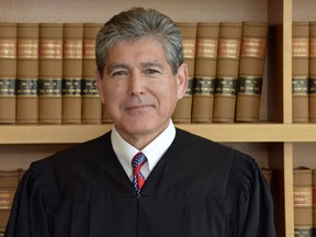 This July 17, 2018 photo provided by the U.S. District Court in the Southern District of California shows Judge Dana Sabraw in San Diego. Judge Sabraw, who ordered children be reunited with their families after being separated at the US-Mexico border, has been unyielding in his insistence that the Trump administration meet his deadline. Judge Sabraw gave the government until Thursday, July 26, 2018 to reunite more than 2,500 children 5 years old and older.