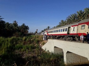 A derailed train remains on the track near the Salwa station in Kom Ombo, north of Aswan, Egypt, Sunday, July 29, 2018. Egyptian authorities said that at least six people were injured in the accident when eight of the train's carriages derailed. Egypt's railway system has a poor safety record, mostly blamed on decades of badly maintained equipment and poor management. Official figures show that 1,793 train accidents took place in 2017. (Aswan Governorate via AP)
