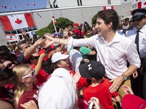 Prime Minister Justin Trudeau greets revellers during Canada Day festivities in Leamington Ont. Sunday, July 1, 2018.