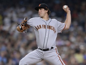 San Francisco Giants starting pitcher Derek Holland works against a San Diego Padres batter during the third inning of a baseball game Monday, July 30, 2018, in San Diego.