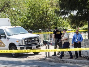 San Bernardino County Sheriff's personnel investigate the scene of a fatal shooting, Friday, July 20, 2018 in Muscoy, Calif. Authorities say a 4-year-old boy accidentally shot and killed his 2-year-old cousin at a home in Southern California.