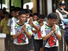 Some of the twelve Thai boys, rescued from a flooded cave after being trapped, arrive to attend a press conference in Chiang Rai on July 18, 2018, following their discharge from the hospital.