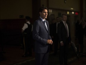 Prime Minister Justin Trudeau takes questions from reporters following his meeting with Ontario Premier Doug Ford at the Ontario Legislature, in Toronto on Thursday, July 5, 2018.