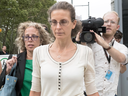 Clare Bronfman leaves Federal court with her attorney Susan Necheles, left, on July 25, 2018, in Brooklyn, New York. 