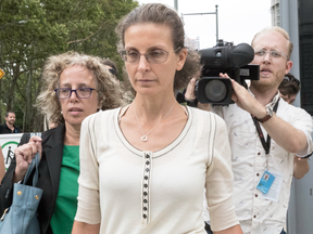 Clare Bronfman leaves Federal court with her attorney Susan Necheles, left, on July 25, 2018, in Brooklyn, New York.