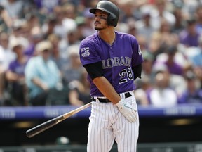Colorado Rockies' Nolan Arenado reacts after striking out against Oakland Athletics starting pitcher Frankie Montas in the fifth inning of a baseball game Sunday, July 29, 2018, in Denver.