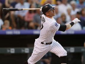 Colorado Rockies' Trevor Story follows the flight of his two-run home run off Seattle Mariners starting pitcher Christian Bergman in the third inning of an interleague baseball game Friday, July 13, 2018, in Denver.