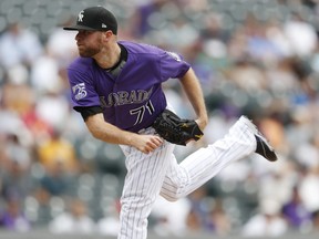 Colorado Rockies reliever Wade Davis watches a pitch to Arizona Diamondbacks' Chris Owings during the ninth inning of a baseball game Thursday, July 12, 2018, in Denver. The Rockies won 5-1.