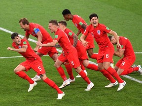 From left to right: England players John Stones, Harry Kane, Jamie Vardy, Kieran Trippier, Marcus Rashford, Harry Maguire and Jordan Henderson celebrate their win over Colombia in penalty kicks at the World Cup on July 3.