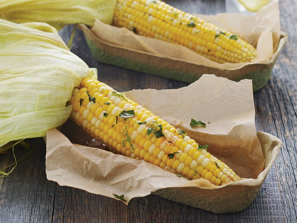 Cook this Roasted corn on the cob with lime basil butter from