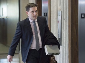 Benjamin Perryman, Abdoul Abdi's lawyer, arrives at Federal Court for a hearing to determine whether deportation proceedings should be halted for the former child refugee, in Halifax on Thursday, Feb. 15, 2018. A Federal Court judge has set aside a decision to refer the case of Abdi to a deportation hearing, saying Ottawa did not take the former Somali child refugee's charter rights into consideration.