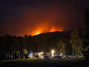 Communities are still recovering from British Columbia's worst wildfire season on record, one year after a fateful two-day period in July 2017 that sparked more than 100 new fires and prompted the province to declare a state of emergency. A wildfire burns on a mountain behind a home in Cache Creek, B.C., in the early morning hours of Saturday, July 8, 2017.
