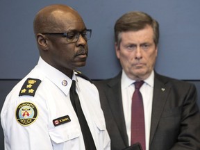 Toronto police will add 200 frontline officers to the night shift this summer in an effort to reduce gun violence in the city. Toronto police chief Mark Saunders and Toronto mayor John Tory are seen at a news conference at TPS headquarters in Toronto on Tuesday, April 24, 2018. Saunders said officers will be dispatched to areas that require them and noted that neighbourhoods will not be saturated with police.