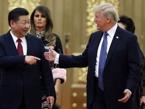 U.S. President Donald Trump China's President Xi Jinping arrive for the state dinner with the first ladies at the Great Hall of the People in Beijing, China on Nov. 9, 2017. Grim scenarios of collateral damage for Canadian consumers and businesses are emerging in response to escalating the U.S.-China trade war.