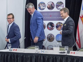 The federal government is investing $700 million over six years in employment and skills training programs in Nova Scotia. Treasury Board president Scott Brison, left to right, Nova Scotia Premier Stephen McNeil and Veterans Affairs Minister Seamus O'Regan share a laugh at the end of the closing news conference of the Atlantic Growth Strategy Leadership Committee in Summerside, P.E.I., on Tuesday, July 10, 2018.