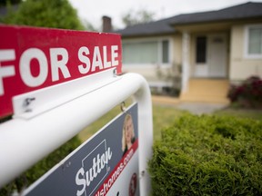 A real estate sign is pictured in Vancouver, B.C., June 12, 2018. A website for buyers of overseas properties says Chinese nationals enquired about US$1.45 billion worth of Canadian properties last year with interest in Toronto and Vancouver slipping following the introduction of foreign buyers taxes.