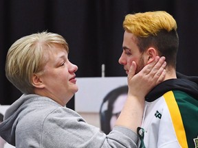 A Humboldt Broncos forward who walked away from the bus crash with minor injuries has decided to keep playing hockey. Nick Shumlanski, 21, has committed to playing for the University of Prince Edward Island Panthers in Charlottetown. Shumlanski is comforted by a mourner during a vigil at the Elgar Petersen Arena, home of the Humboldt Broncos, to honour the victims of a fatal bus accident in Humboldt, Sask., on Sunday, April 8, 2018.
