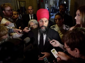 NDP Leader Jagmeet Singh speaks to reporters in the in the Foyer of the House of Commons on Parliament Hill in Ottawa on June 19, 2018. The federal New Democrats are trailing behind the Conservative party and the Liberal party in their fundraising efforts, pulling in less than a million dollars from far fewer donors than the other parties. Quarterly fundraising returns posted on the Elections Canada website show the NDP raised just $872,401 from 12,451 contributions over the last three months which ended June 30.