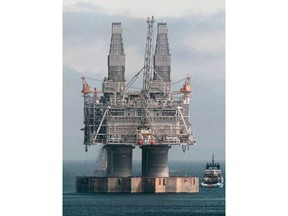 A tug positions itself near the base of the Hibernia platform in Bull Arm, Trinity Bay, Nfld., Thursday May 22, 1997. Newfoundland and Labrador's highest court has upheld a decision to reinstate an offshore oil worker who was fired after he tested positive for taking an unauthorized form of tranquilizer.