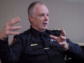 Calgary Police Service chief Roger Chaffin speaks during an interview with