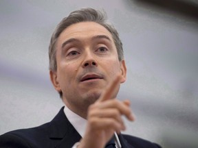 Francois-Philippe Champagne addresses a gathering at the Globe Forum in Vancouver, Wednesday, March 14, 2018. An online map laying out billions in infrastructure spending approved by the Trudeau Liberals has yet to include details on even more spending.