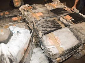 Seized packages of cocaine are shown in a government of Martinique handout photo. Two Quebec men are in a Martinique jail after a sailboat brimming with cocaine was set ablaze on open water earlier this month.THE CANADIAN PRESS/HO-Government of Martinique MANDATORY CREDIT
