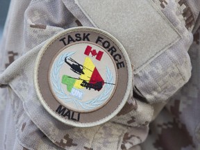The arrival of Canadian troops in Mali is coinciding with raised hopes and heightened tensions over what is expected to be a decisive moment in the West African country's recent history: presidential elections later this month. The UN Mali patch is shown on a Canadian forces member's uniform before boarding a plane at CFB Trenton in Trenton, Ontario, on Thursday July 5, 2018.