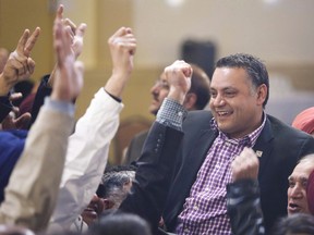 Prab Gill, right, celebrates his byelection win in the Calgary Greenway riding in Calgary on March 22, 2016. Alberta's NDP caucus is accusing United Conservative Leader Jason Kenney and one of his former caucus members of misusing public money to promote their party. The caucus says it has asked the Speaker of the legislature to investigate a bill submitted by Calgary MLA Prab Gill for more than $7,000 to reimburse him for hosting a banquet in February.