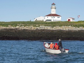 A Canadian fishermen's group says that in the past two weeks, at least 10 fishing boats from New Brunswick have been intercepted by U.S. patrol agents while fishing around Machias Seal Island. Visitors head to Machias Seal Island on Friday, June 24, 2016.
