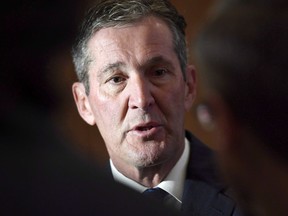 Manitoba Premier Brian Pallister speaks to reporters before a Council of the Federation meeting in Ottawa on Tuesday, Oct. 3, 2017. Manitoba's public-sector unions have lost a bid for a temporary court injunction against a provincial government bill that would freeze their wages. A Court of Queen's Bench justice has rejected the unions' request for an injunction to halt the proposed law until a constitutional challenge can be heard at a later date.THE CANADIAN PRESS/Justin Tang