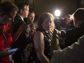 Ontario MPP Lisa Macleod turns away after scrumming with reporters at the Ontario Legislature, in Toronto on Thursday, July 5, 2018. A newly appointed Ontario minister demanded an apology after Federal Immigration Minister Ahmed Hussen said the province was promoting fear around asylum seekers.