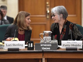 Federal officials overseeing billions in benefit payments to millions of Canadians are hoping artificial intelligence can solve ongoing snags in the system. Minister of Employment, Workforce Development and Labour Patty Hajdu speaks with Lori Sterling, Deputy Minister of Labour and Associate Deputy Minister of Employment and Social Development, as they appear at a Commons human resources committee hearing on Parliament Hill in Ottawa on Monday, Feb. 12, 2018.