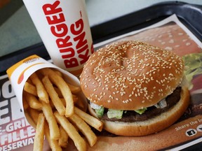 A Burger King Whopper meal combo is shown at a restaurant in Punxsutawney, Pa., on February 1, 2018. At least one quick-service restaurant company with hundreds of locations across Canada may stop requiring its franchisees to sign agreements prohibiting them from hiring employees from another franchisee. The so-called no-poach clause is "common," but has recently caused concern it may stifle wages and prompted a rethinking of practices by large operators.
