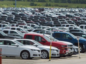 Vehicles are seen in a parking lot at the General Motors Oshawa Assembly Plant in Oshawa, Ont., on Wednesday, June 20, 2018. For the first time since March 2013, there was a decline in Canadian year-to-date new light vehicles sales.